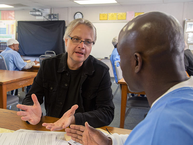 A faculty member in the classroom at San Quentin State Prison